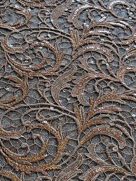 Rust / burnt orange guipure and sequins on tulle