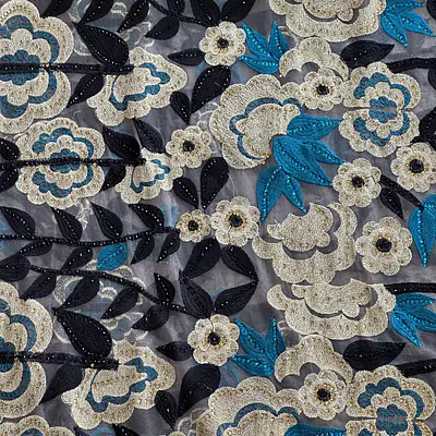 Gold, torquoise and black embroidery on tulle ground with stones primary image