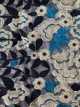 Gold, torquoise and black embroidery on tulle ground with stones